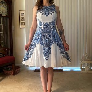 Sleeveless, fit and flare of polyester spandex.